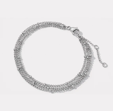Silver triple chain bracelet with delicate stainless steel beads
